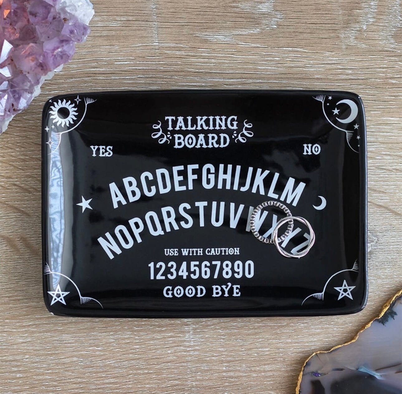 Black talking board trinket dish with engraved spirit board design
