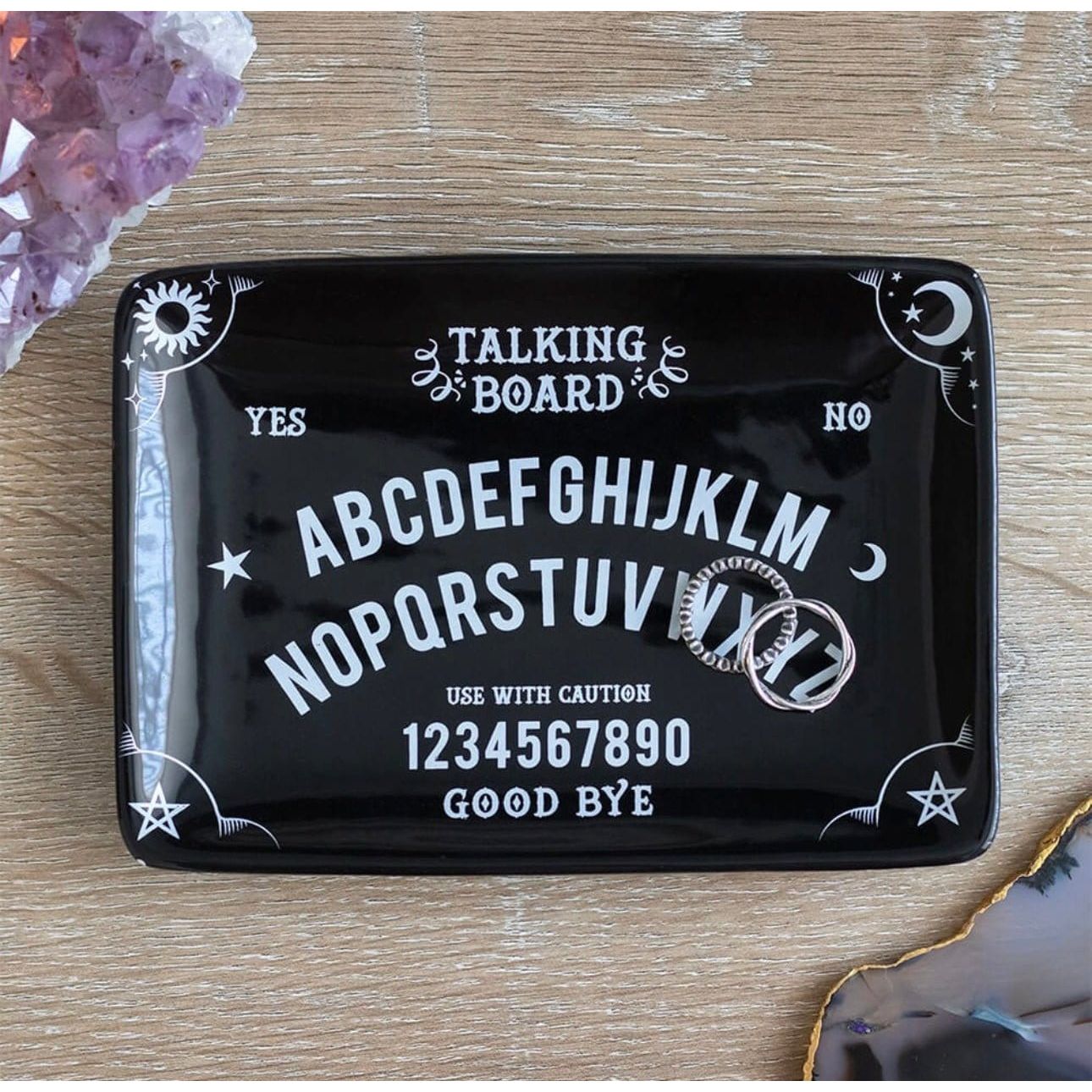 Black talking board trinket dish with engraved spirit board design