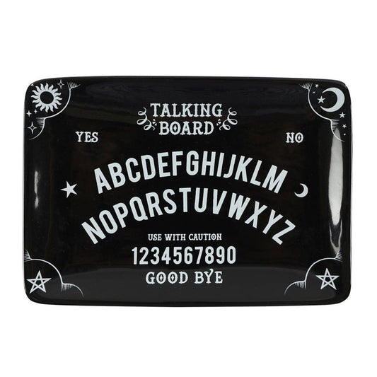 Close-up of black talking board trinket dish with mystical lettering
